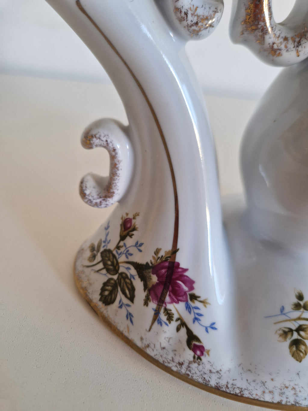 Vintage white porcelain decorative object with floral rose pattern and gold gilt trim.