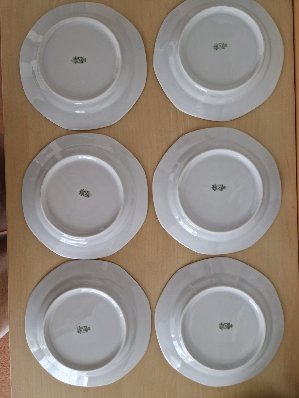 Set of six vintage white porcelain plates with maker's marks on the underside
