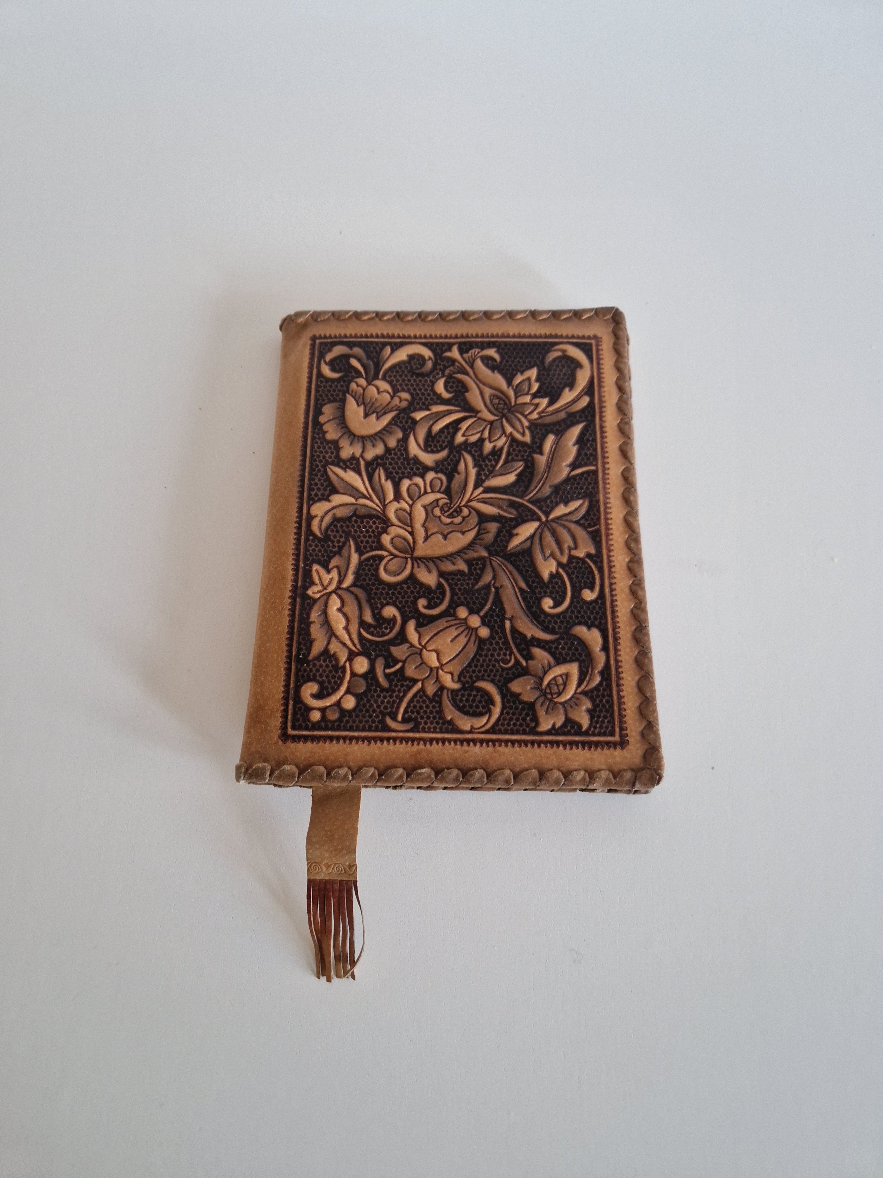 Vintage Hand-Tooled Leather Book Cover with Carved Floral Design & Tassel Closure