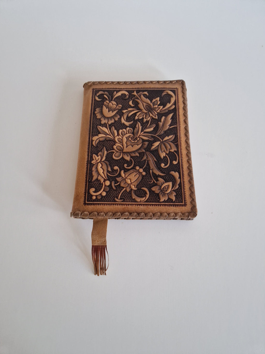 Vintage Hand-Tooled Leather Book Cover with Carved Floral Design & Tassel Closure