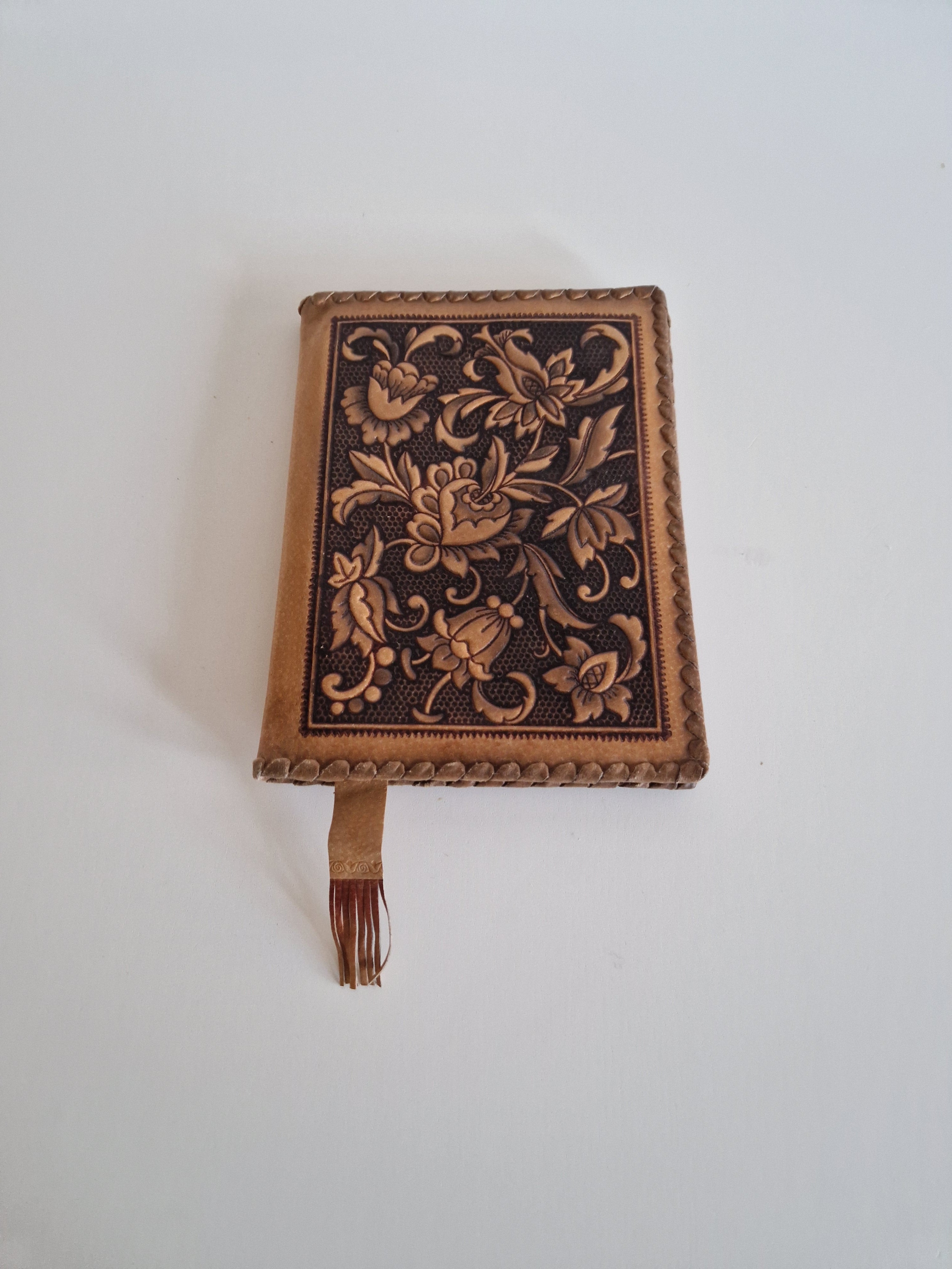 Vintage Hand-Tooled Leather Book Cover with Carved Floral Design & Tassel Closure