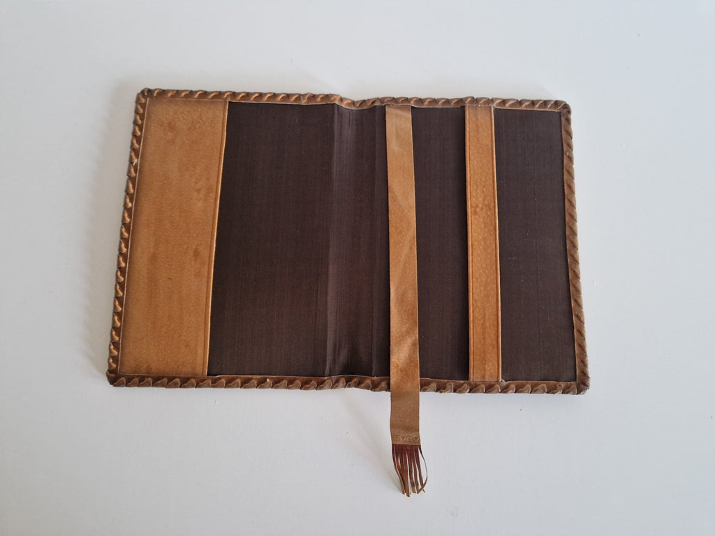 Vintage Hand-Tooled Leather Book Cover with Carved Floral Design & Tassel Closure