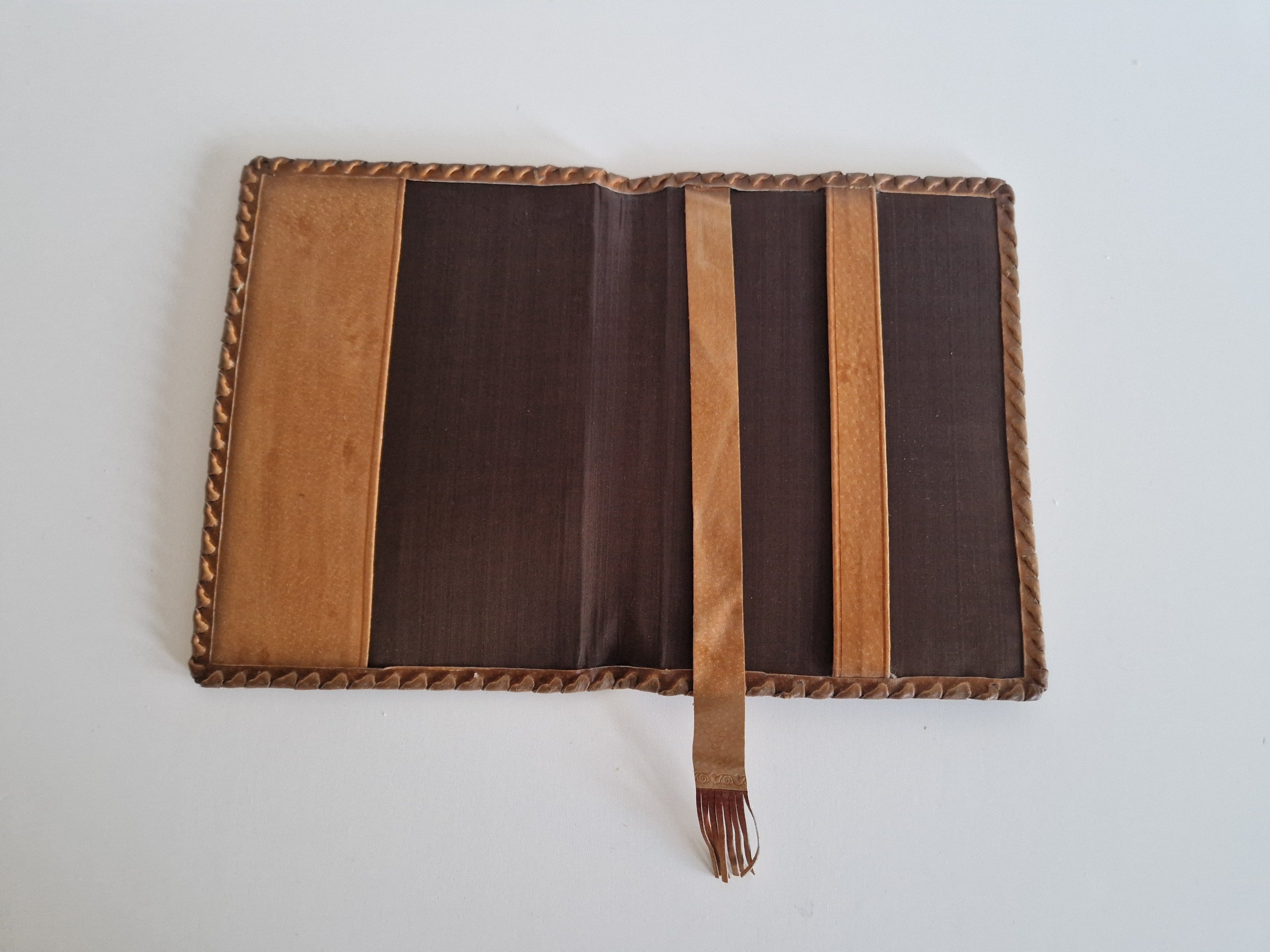 Vintage Hand-Tooled Leather Book Cover with Carved Floral Design & Tassel Closure