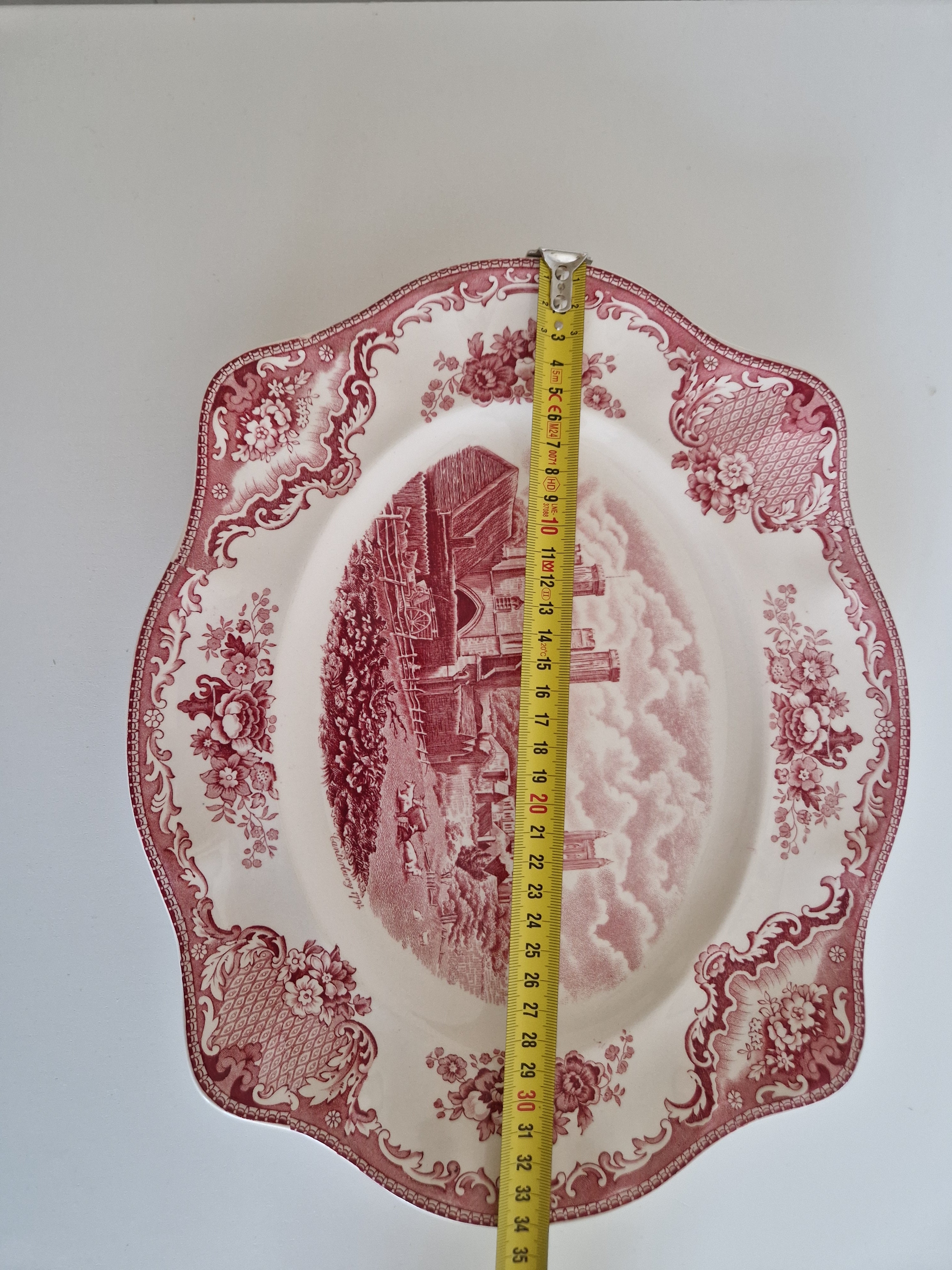 Johnson Bros Old Britain Castles large pink transferware plate front view with tape measure showing 34cm
