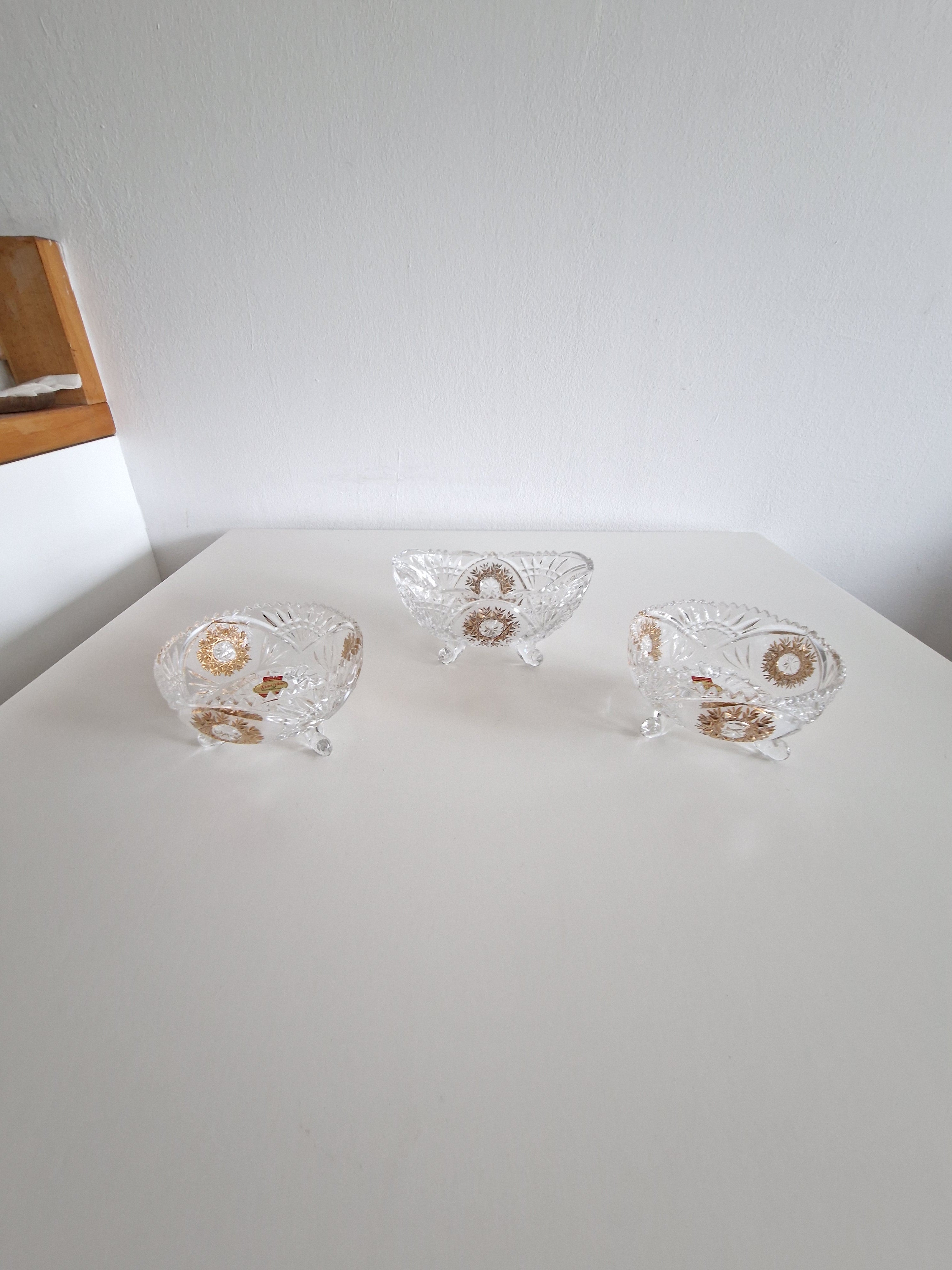 Set of Three Anna Hütte Cut Crystal Salt Cellars with Gold Sunburst Medallions — Made in Austria