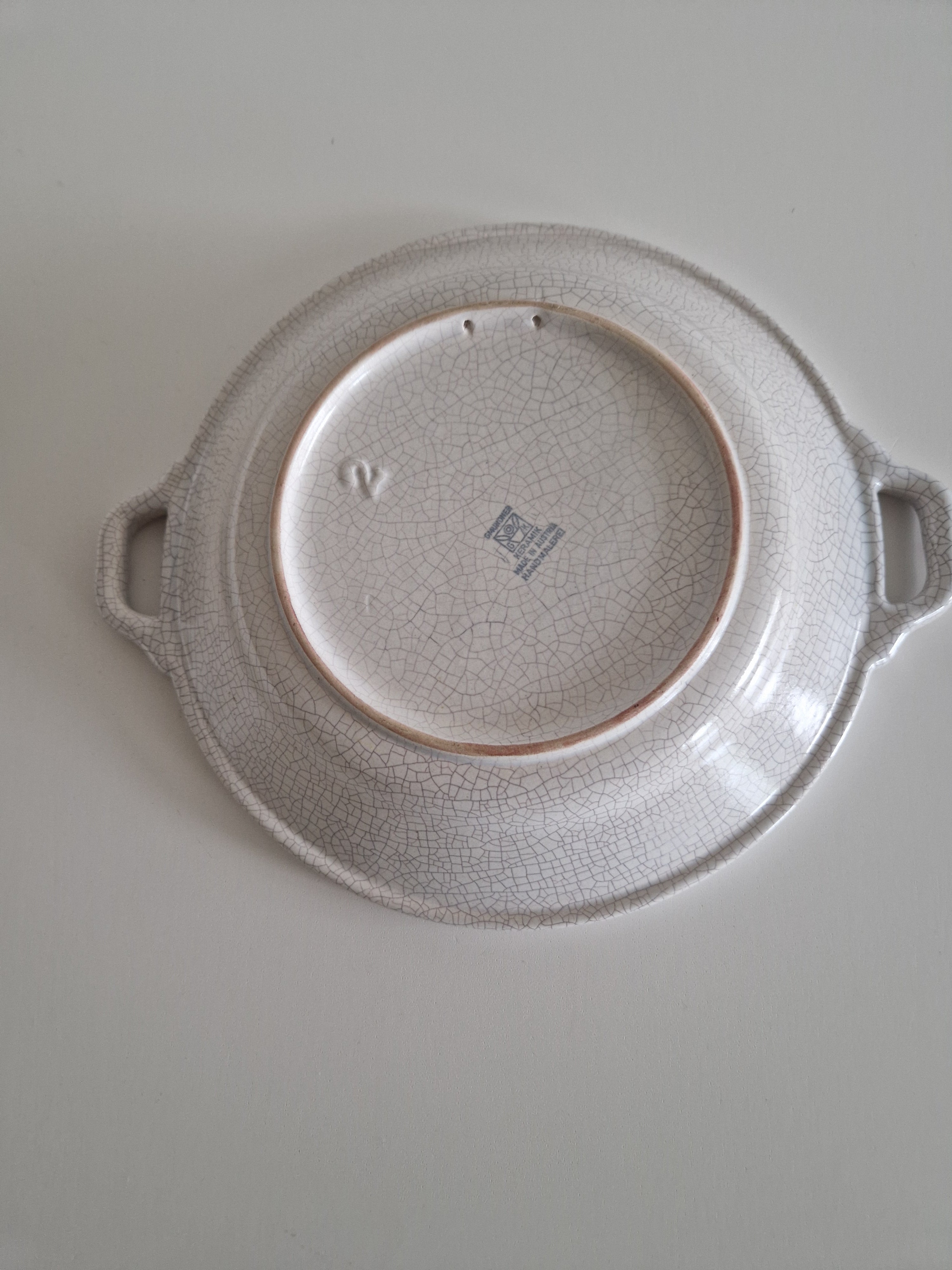 Base of Gmundner Keramik bowl showing crackle glaze reverse and maker mark