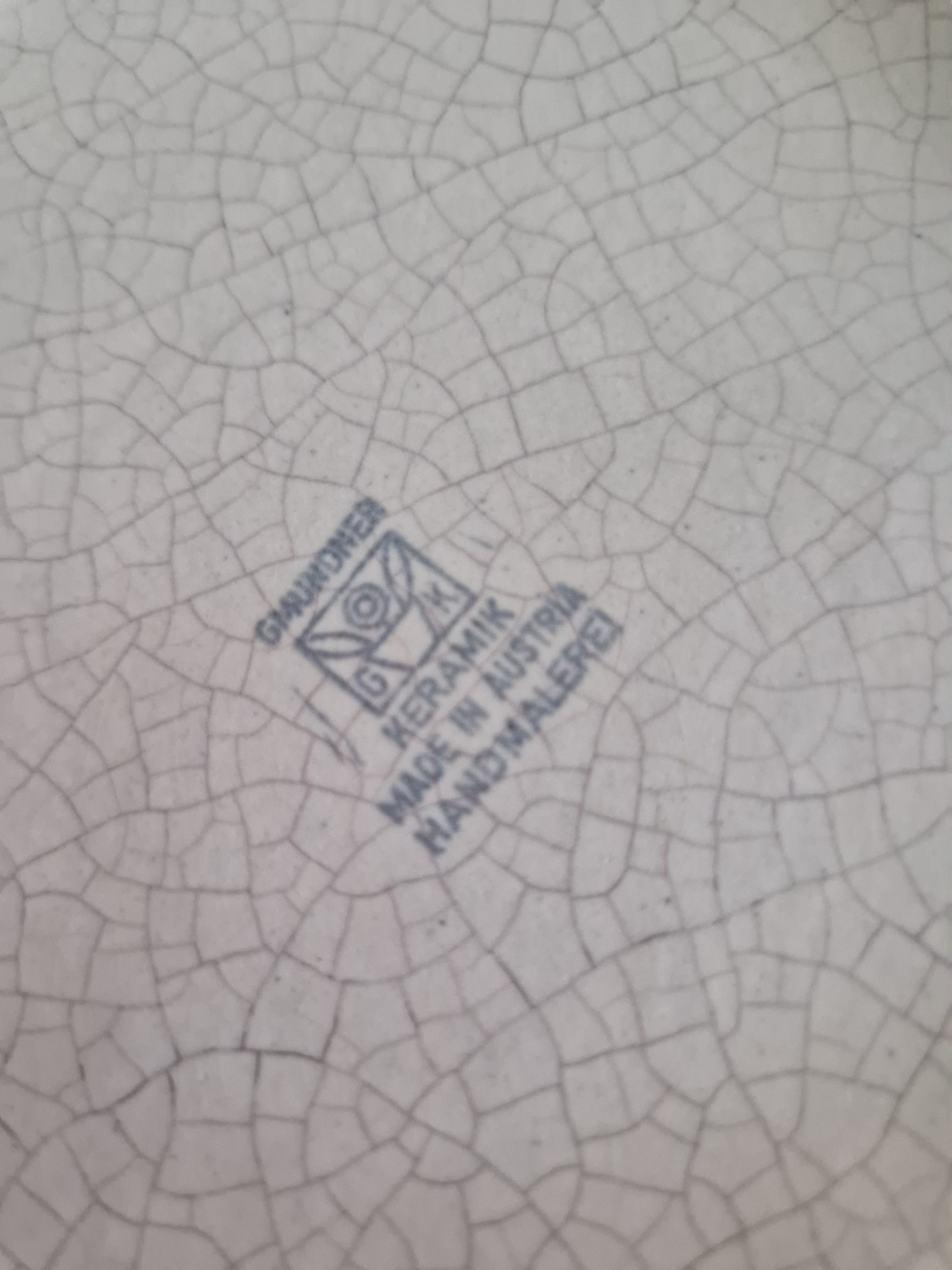 Close-up of Gmundner Keramik backstamp reading Made in Austria Handmalerei