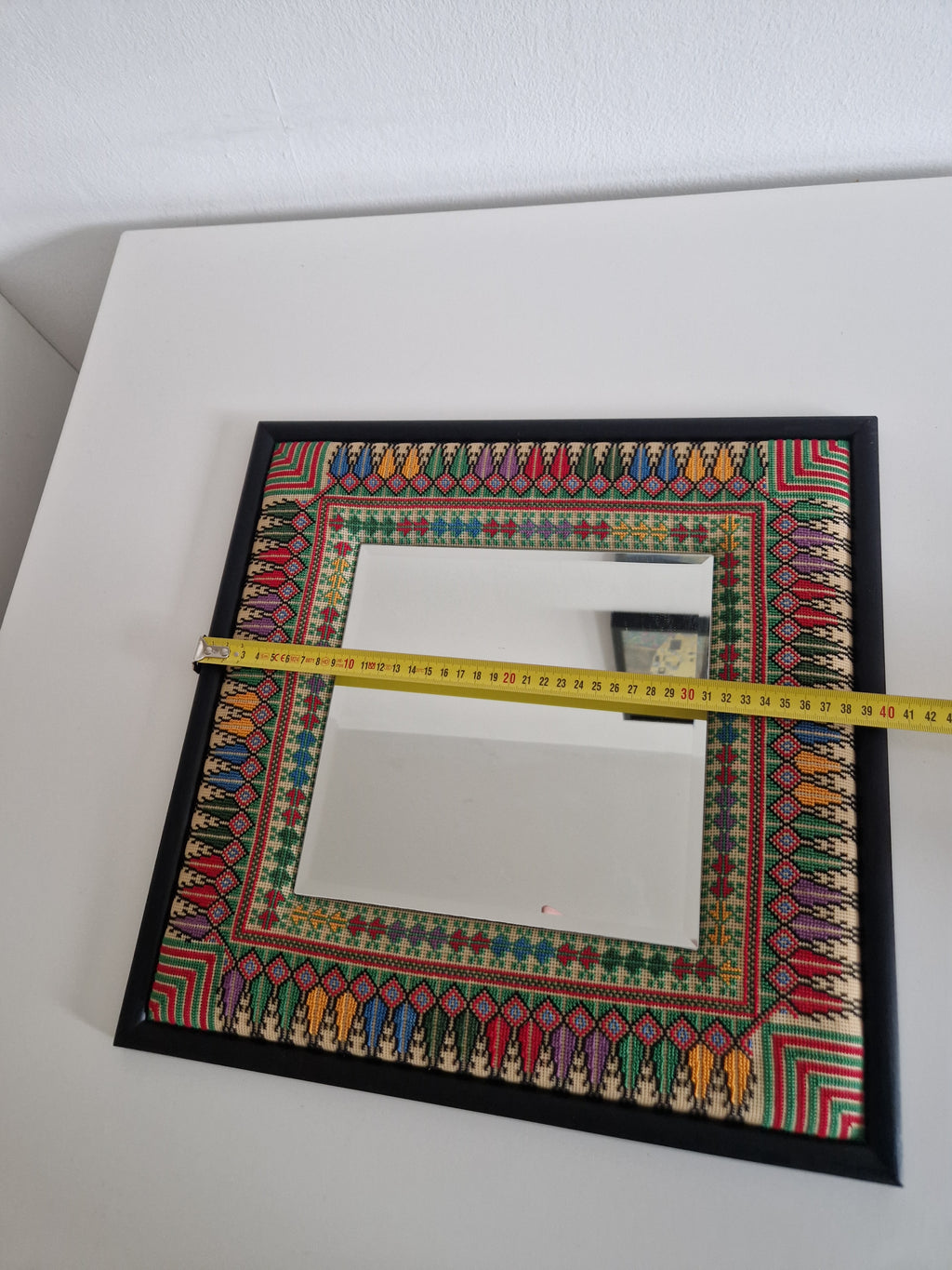 Hand-embroidered cross-stitch folk art mirror, approx. 42x42 cm, with matte black outer frame