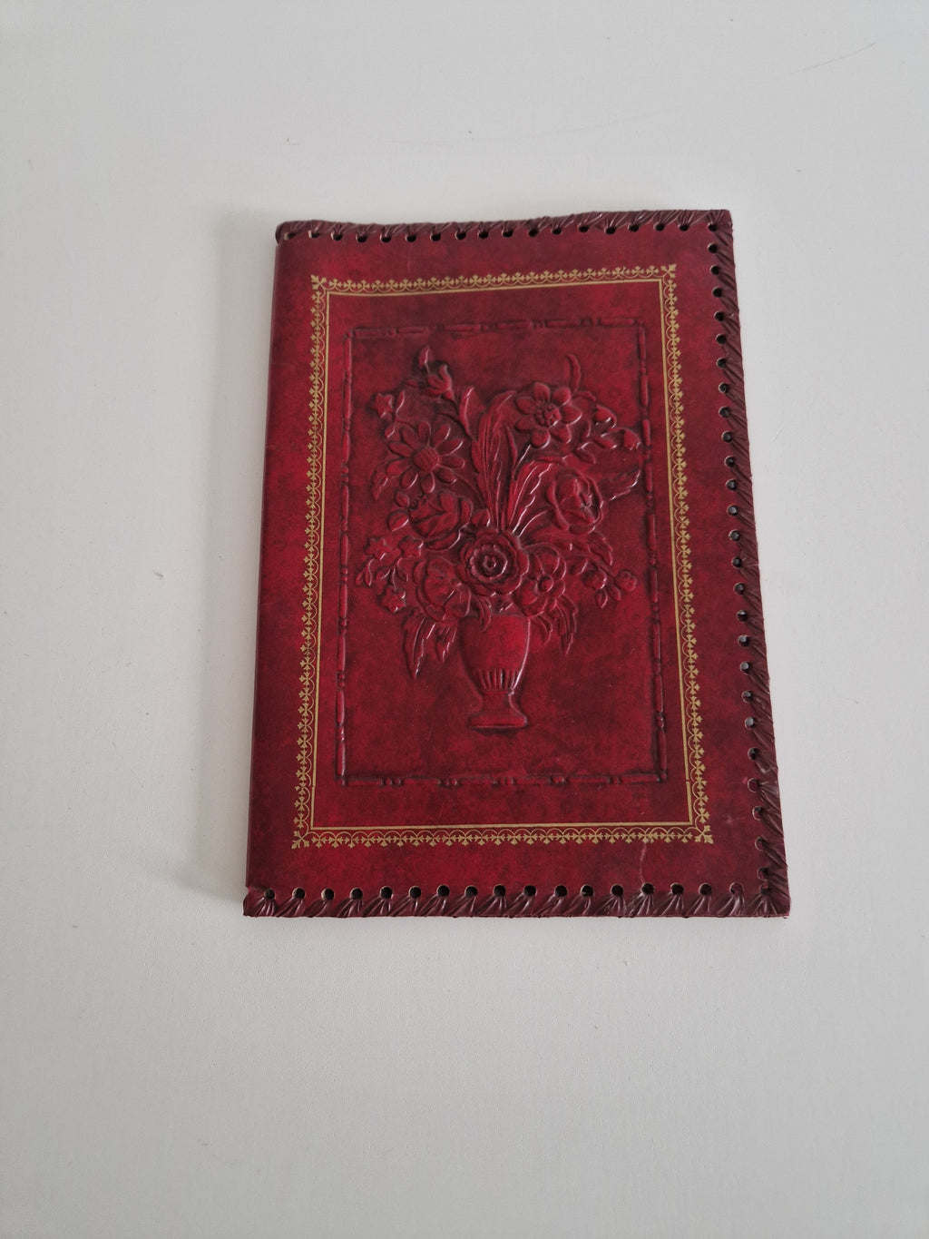 Vintage Hand-Tooled Crimson Leather Book / Journal Cover – Embossed Floral Bouquet & Gold Border | Whipstitch Edge | 20 × 14 cm