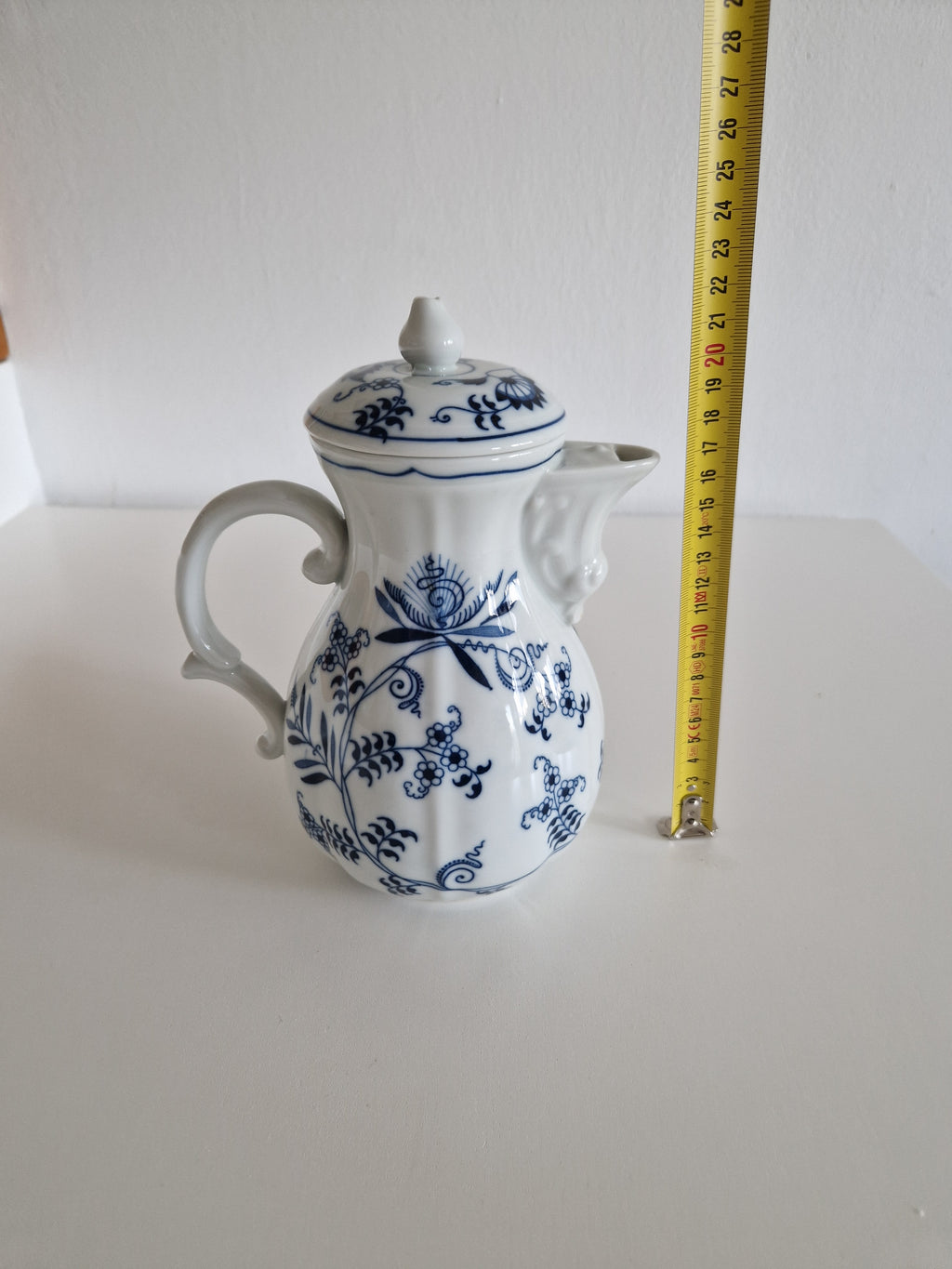 Blue Danube Japan porcelain coffee pot with lid showing blue onion pattern and tape measure at approx 20cm height