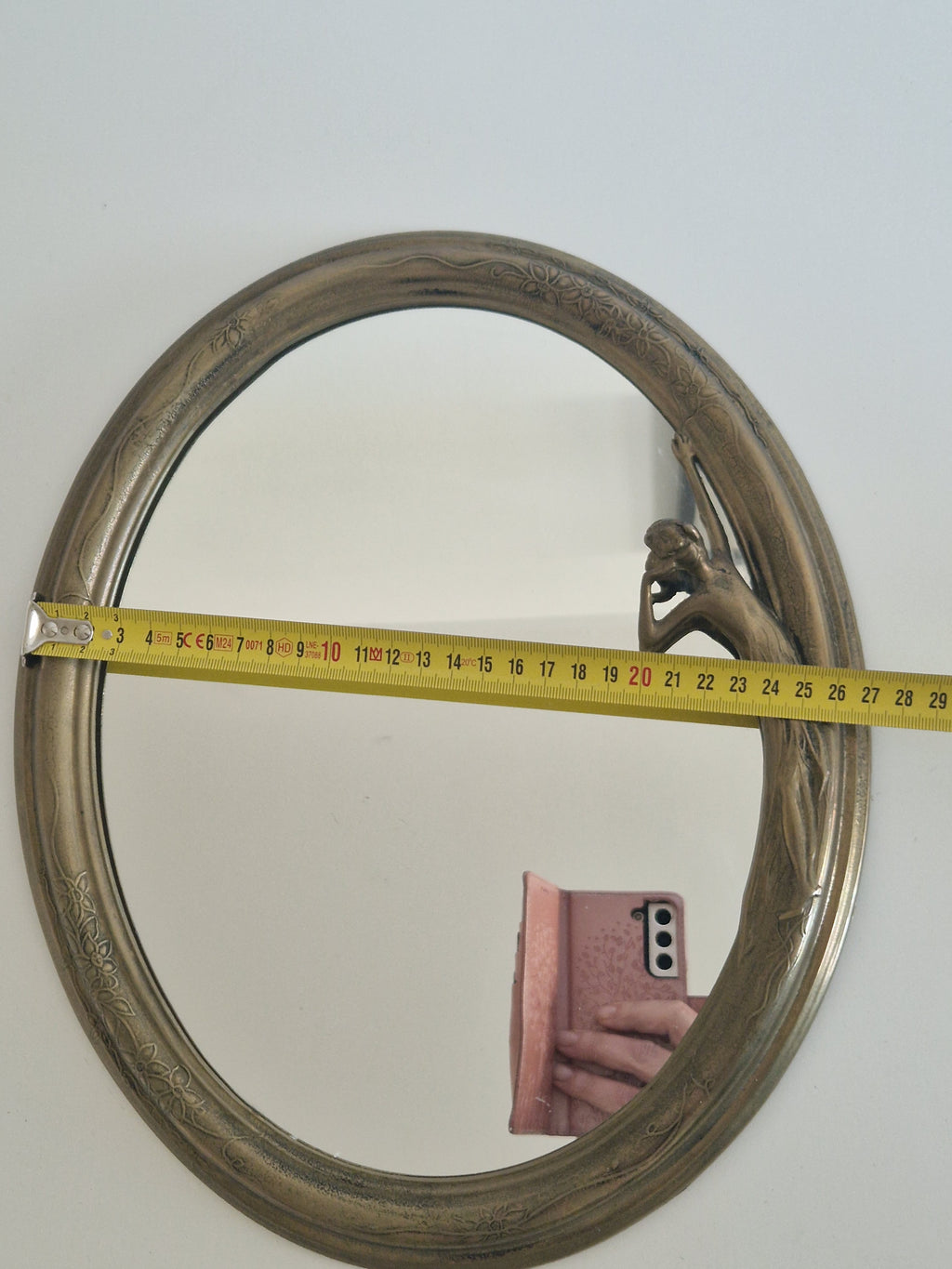 Art Nouveau oval mirror with sculpted female figure, measured at approximately 29 cm wide