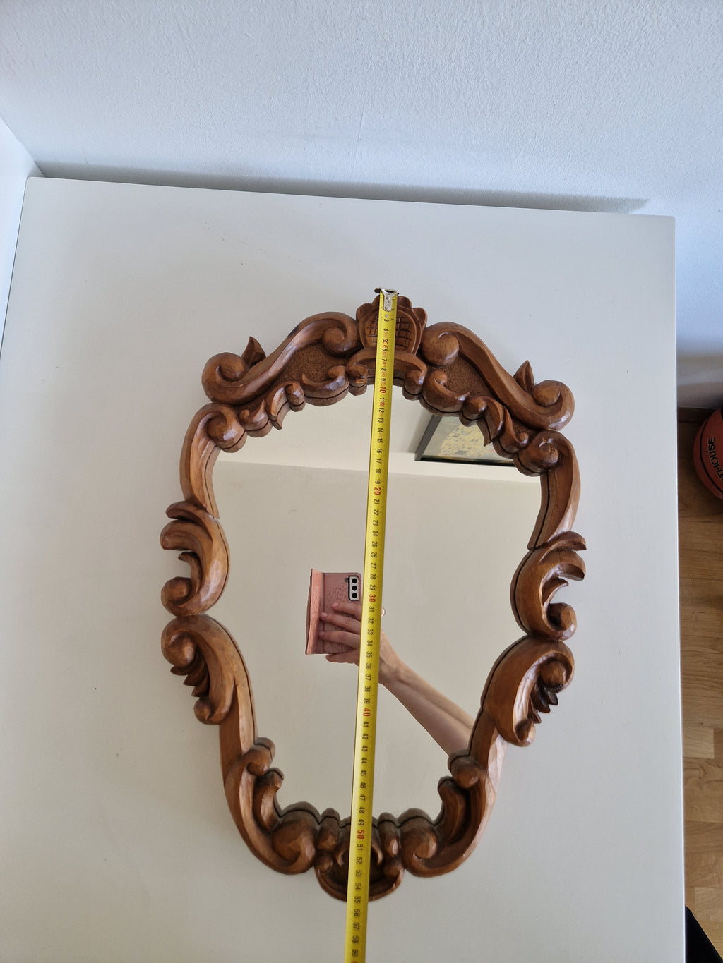 Hand-carved Tyrolean walnut mirror c.1940s, shield-shaped with acanthus scrolls, measured approx. 55 cm tall