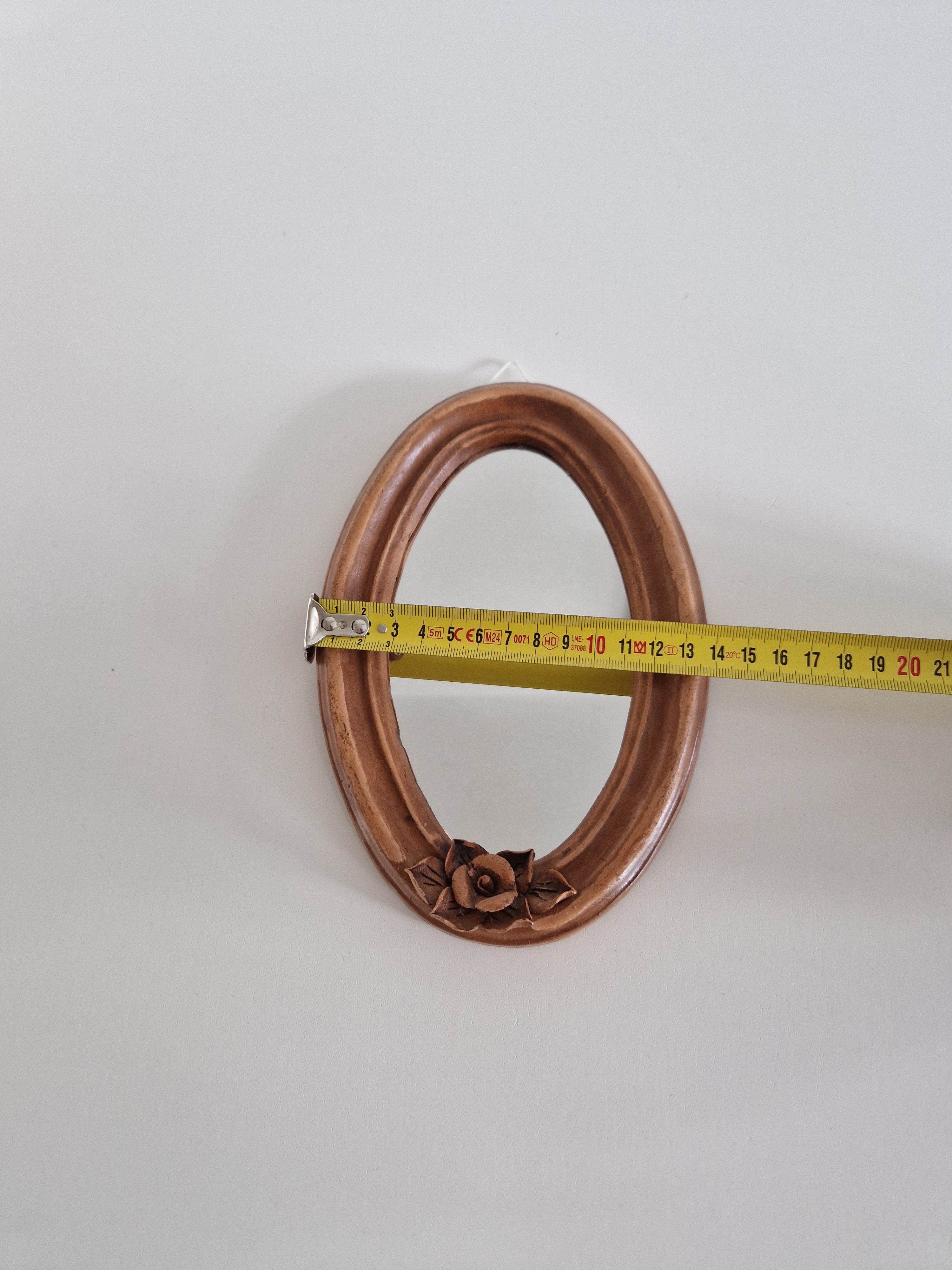 Antique copper oval mirror width measurement approximately 17 cm