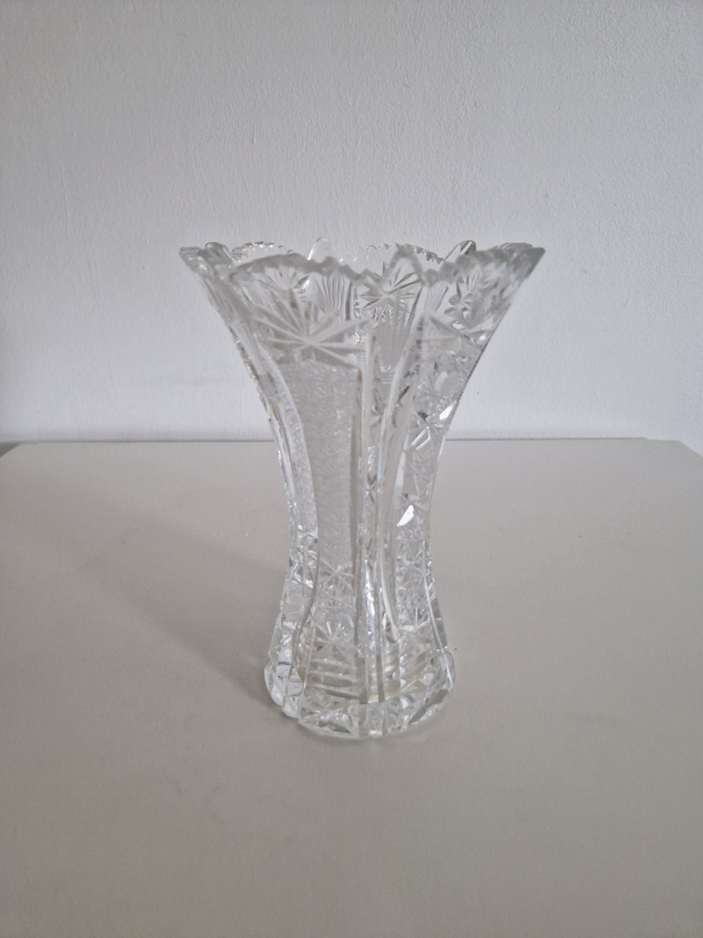 Vintage cut crystal trumpet vase — full side view on white background