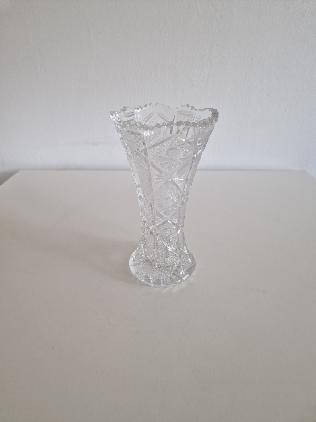 Vintage cut crystal hourglass vase — side view with tape measure showing height approx. 18 cm