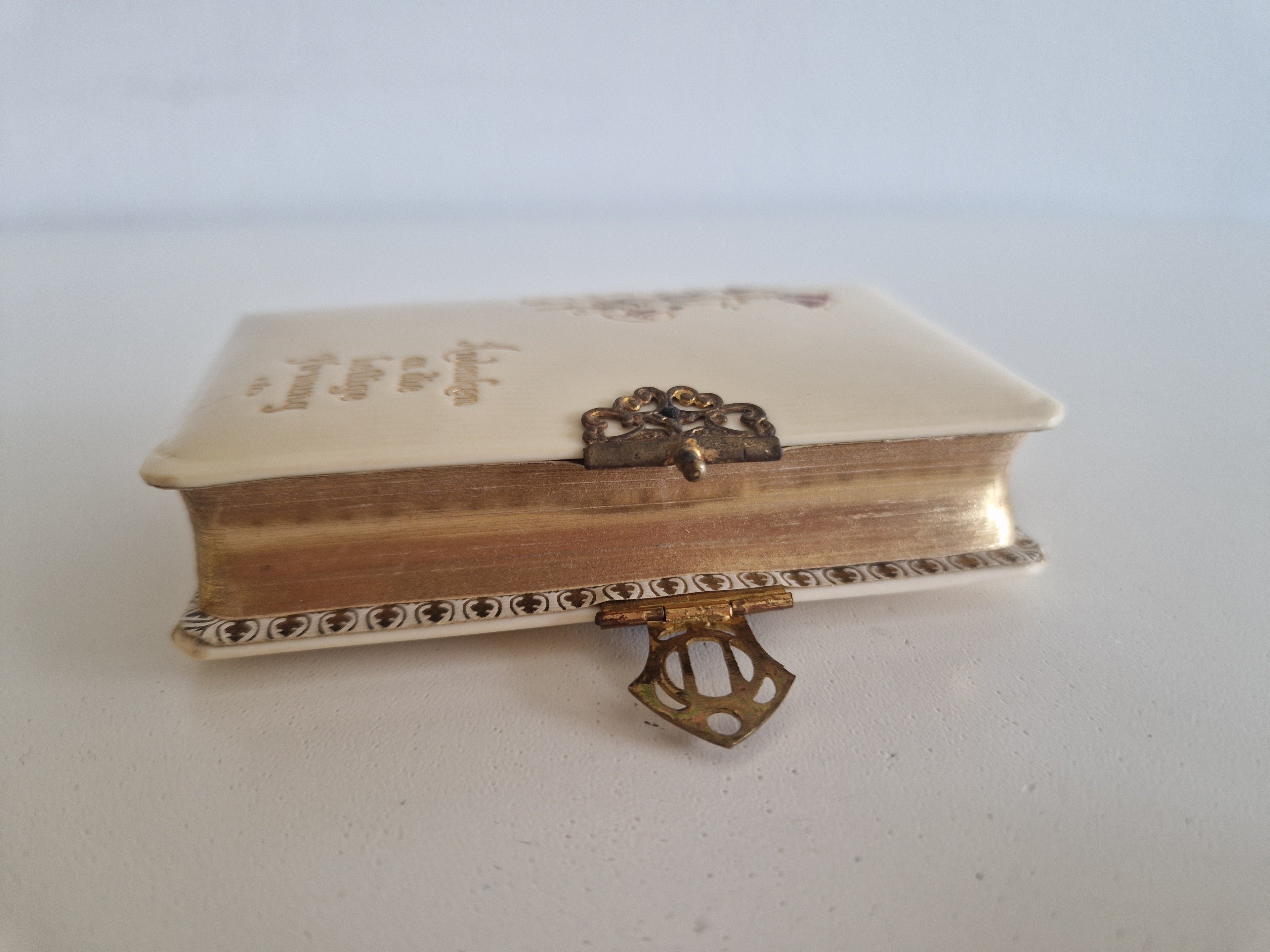 Antique prayer book — width measurement approx. 7 cm with ornate brass filigree clasp and crown keeper