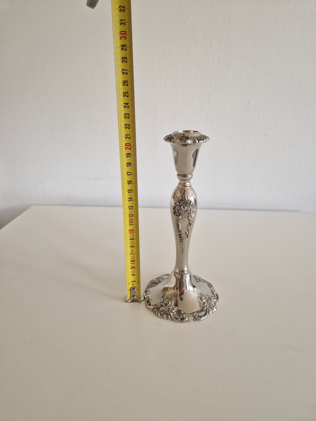 Close-up of baluster stem with chased floral cartouche and acanthus scrollwork