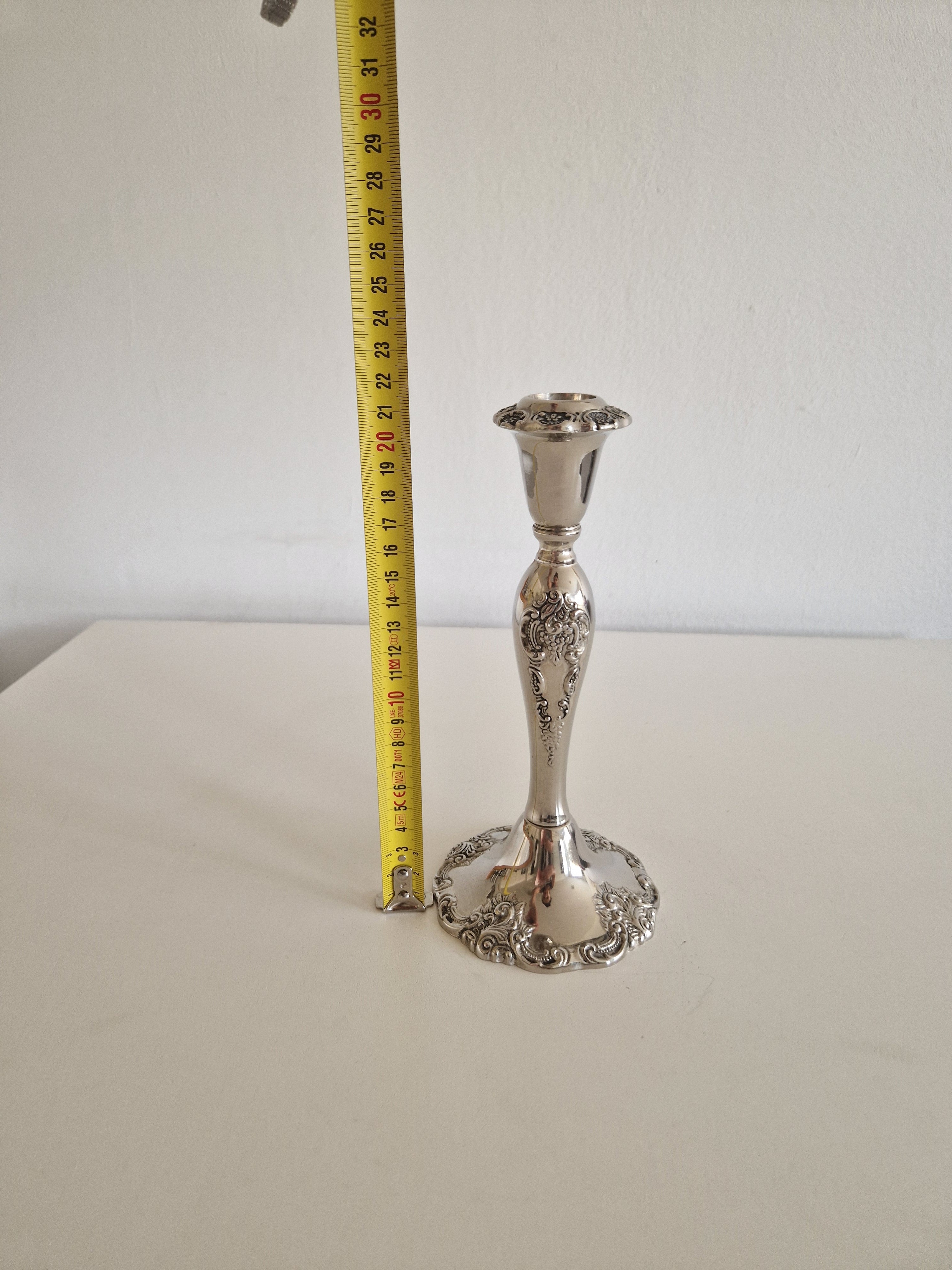 Close-up of baluster stem with chased floral cartouche and acanthus scrollwork