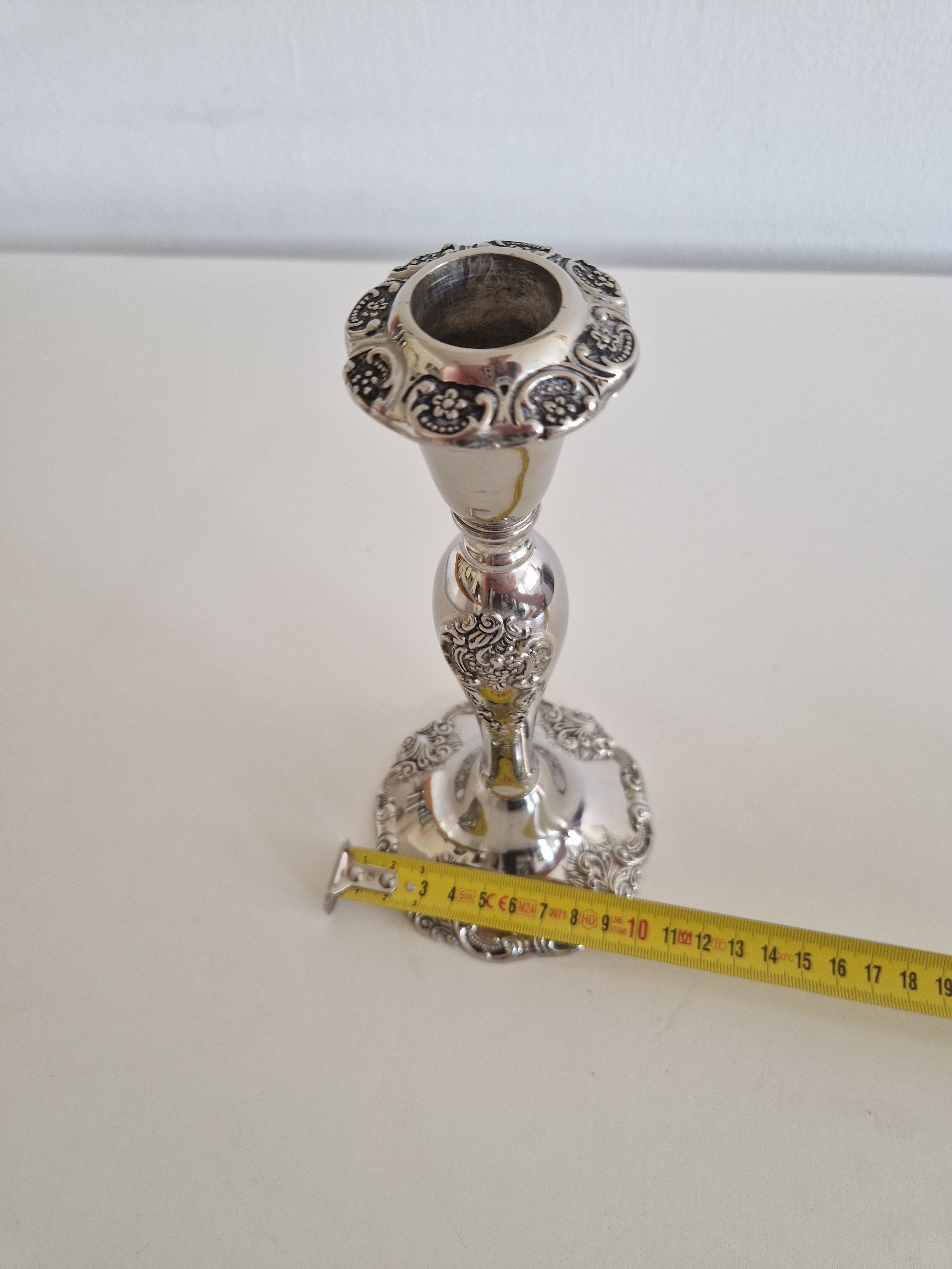 Top-down view of bobeche showing floral medallion embossing