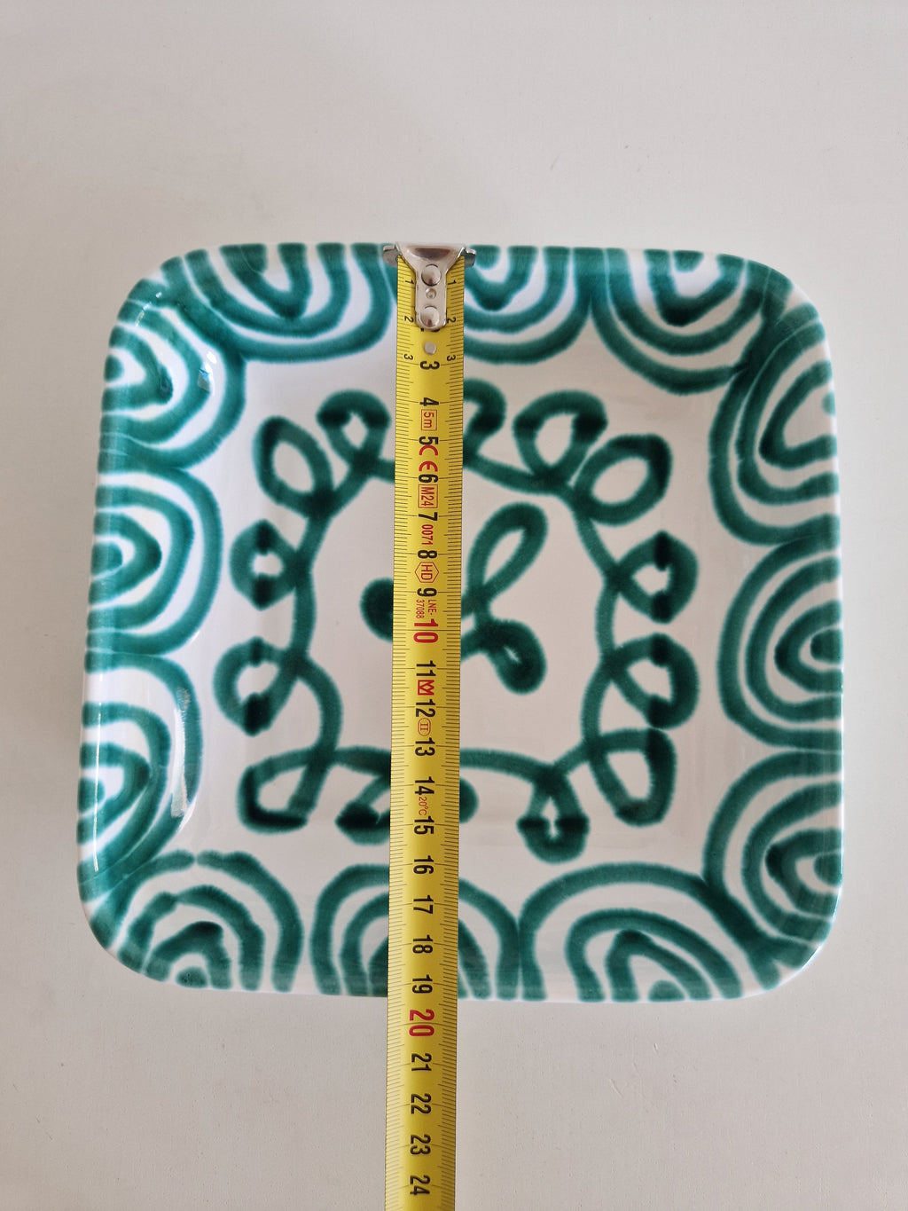 Side view of Gmundner Keramik square dish with tape measure showing approx. 4 cm height