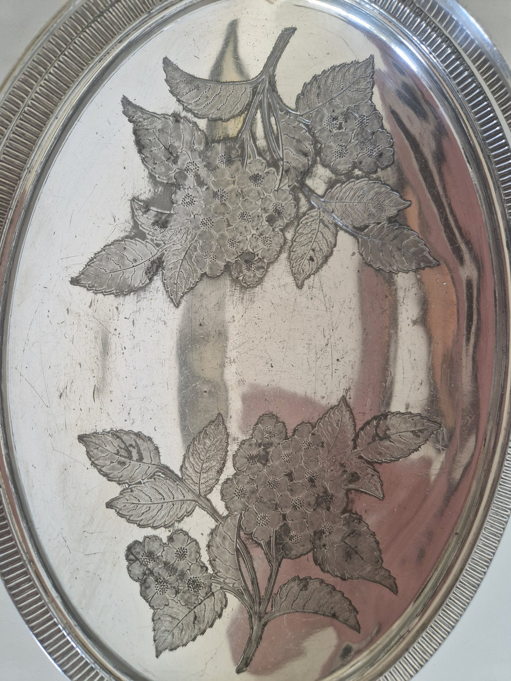 Full view of antique Meriden 1890 silver-plated fruit basket with swing handle upright