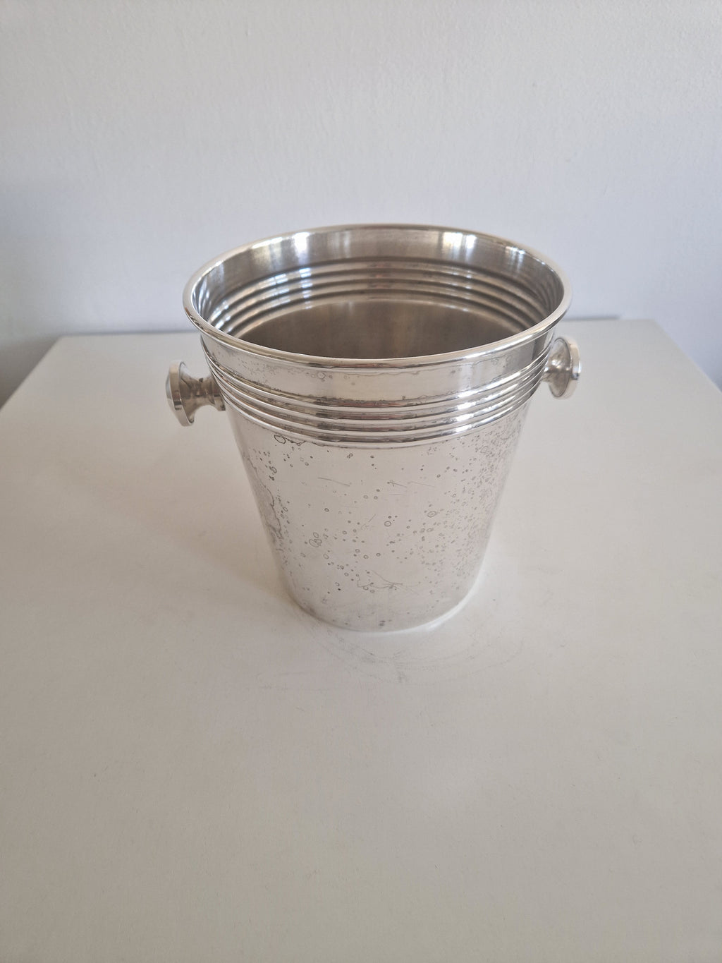 Vintage silver-plated champagne bucket with ring handles and ribbed design