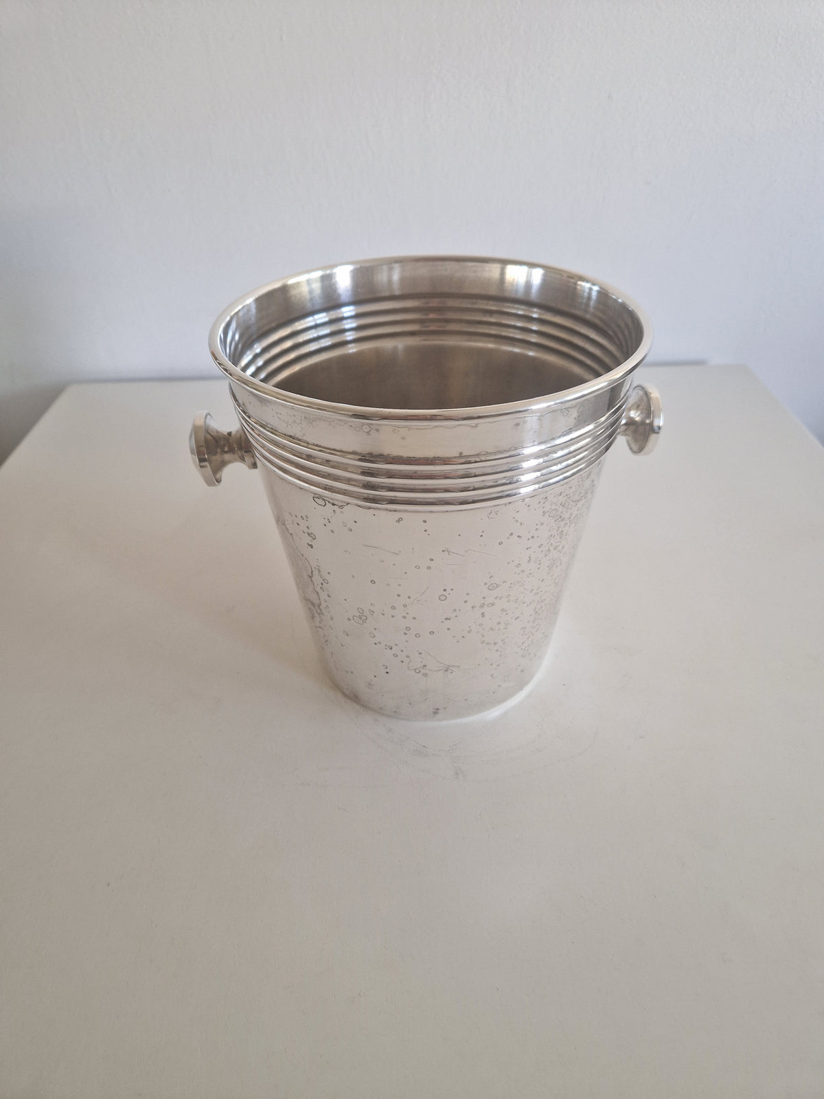 Vintage silver-plated champagne bucket with ring handles and ribbed design