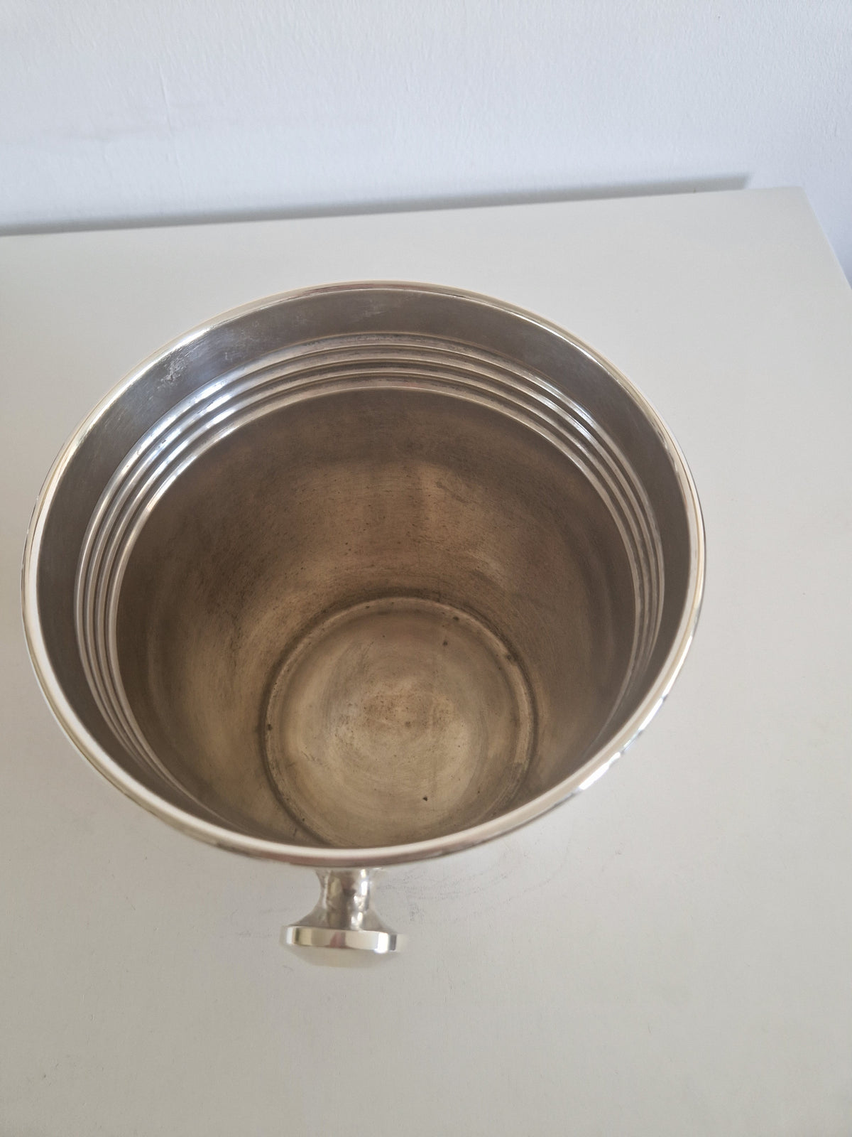 Vintage silver-plated champagne bucket with ribbed detailing and pedestal base.
