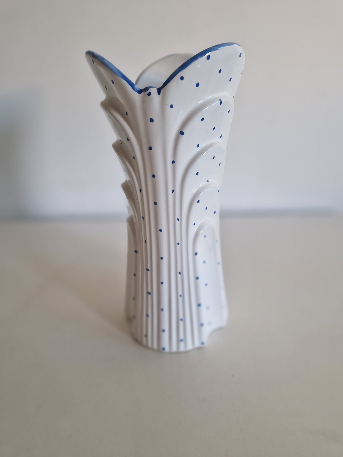 Vintage white porcelain vase with blue polka dots and scalloped edges
