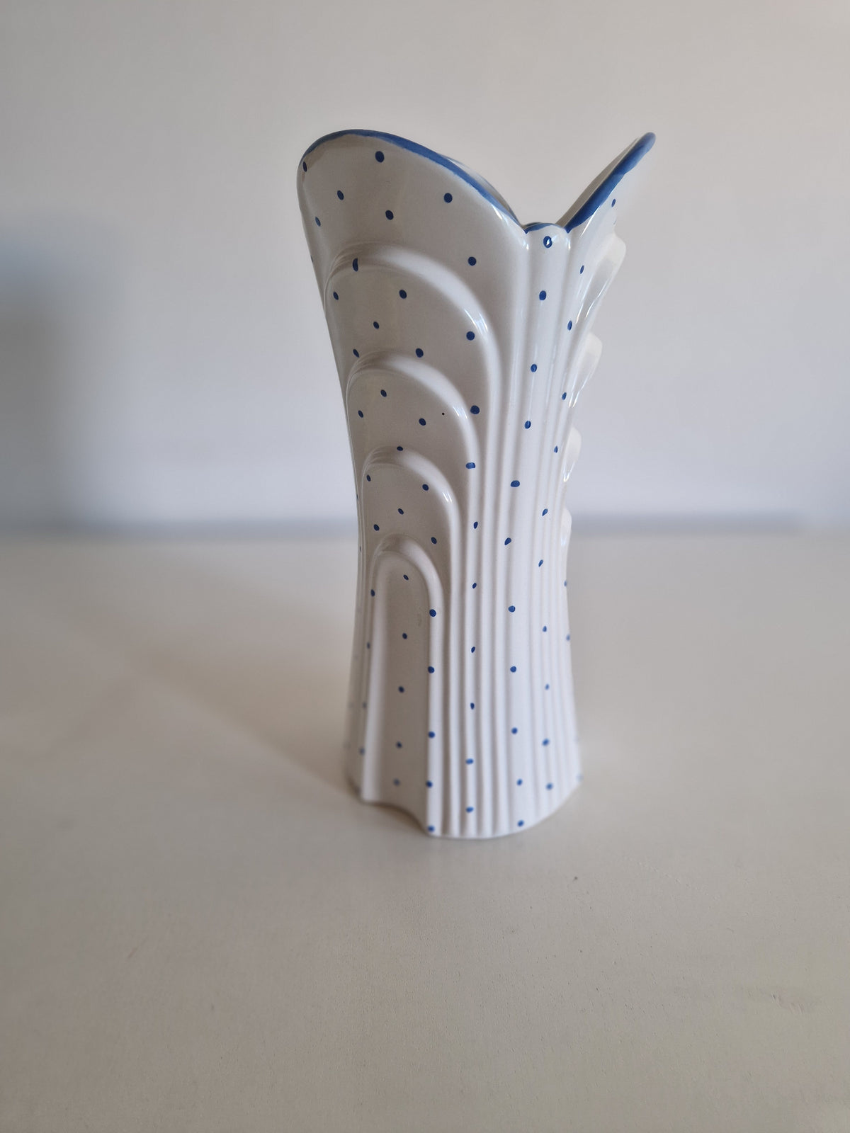 Vintage white porcelain vase with blue polka dots and scalloped wavy edges
