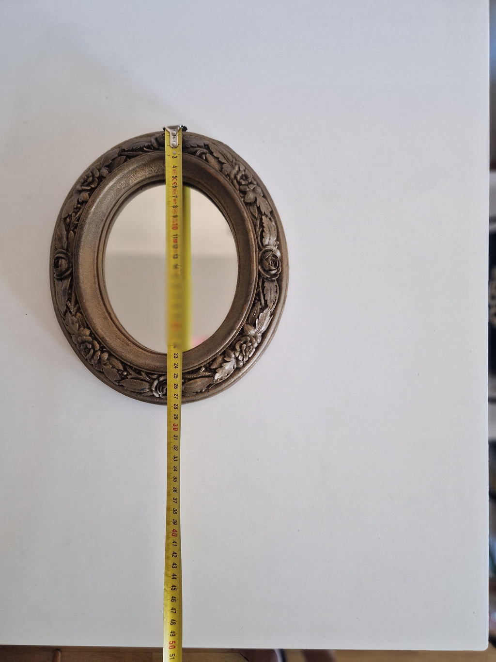 Vintage oval wall mirror with carved wood rose frame – front view with measurements