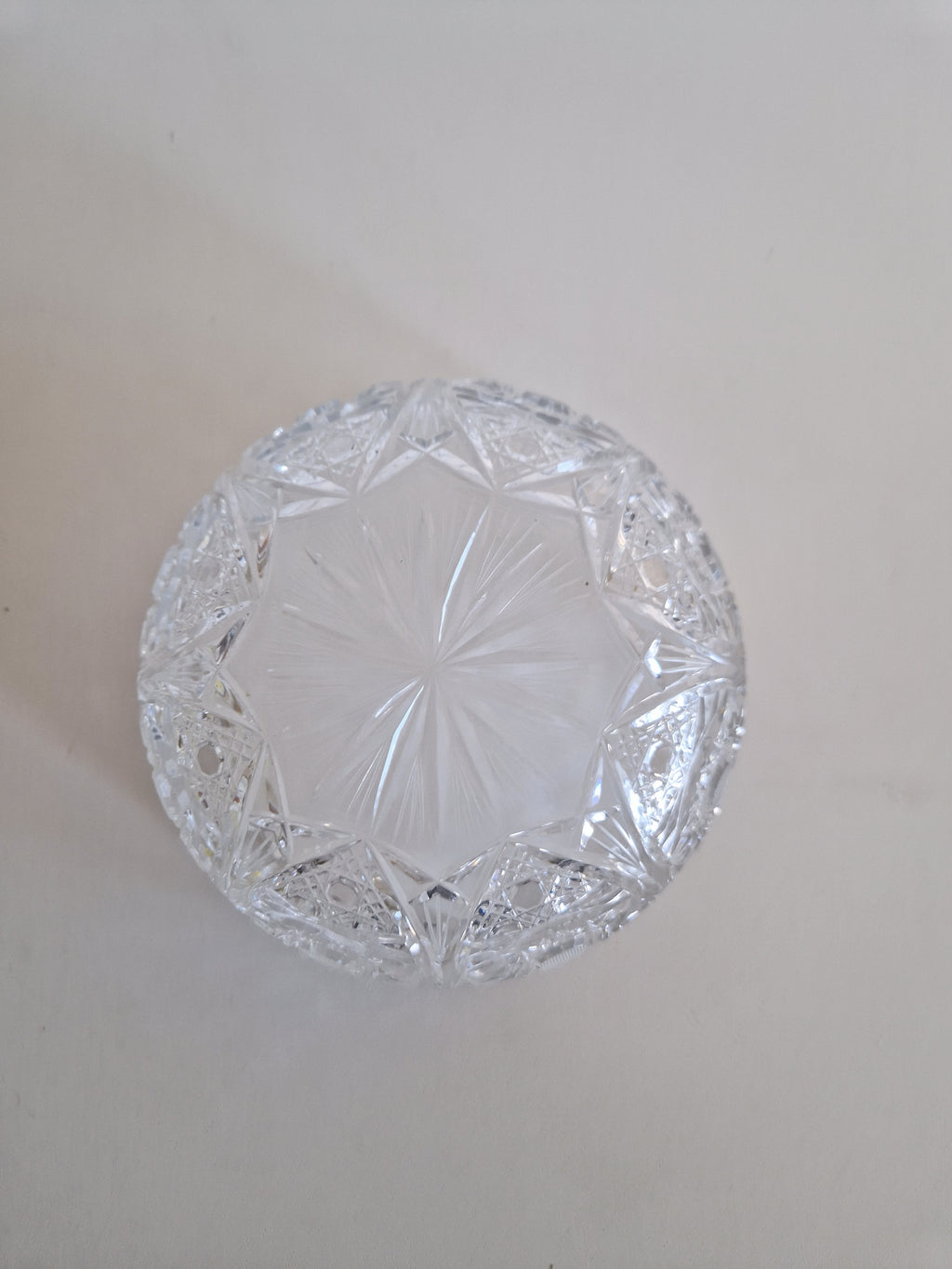 Vintage cut crystal glass bowl with intricate starburst pattern