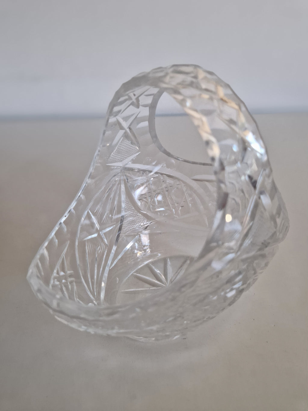 Vintage cut glass crystal basket with intricate geometric patterns