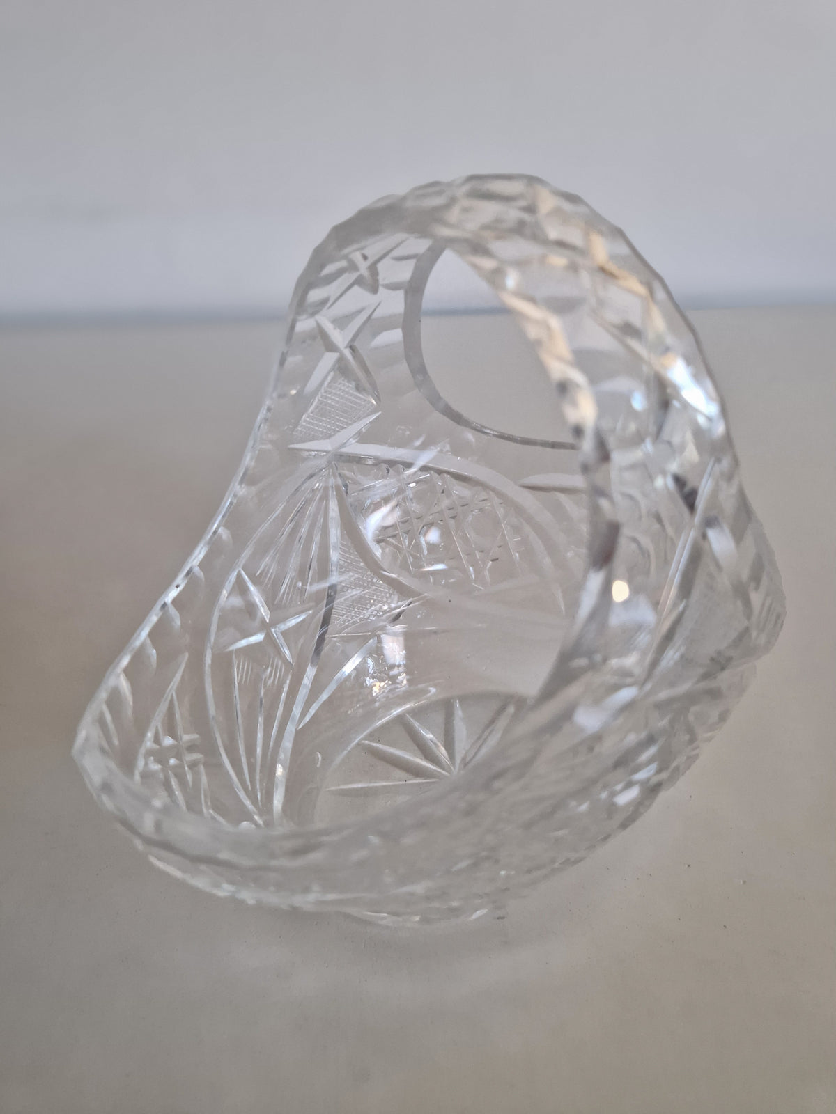 Vintage cut glass crystal basket with intricate geometric patterns