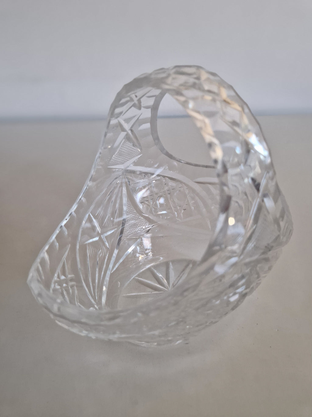 Close-up of cut crystal handle and fan motif detail
